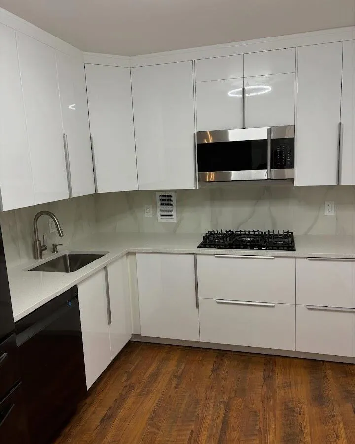 Restored kitchen with white cabinets after water damage in Hallandale Beach